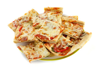 Homemade sliced pizza on white background, close-up shot