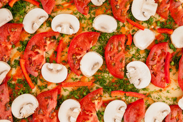 Raw pizza fragment with tomatoes and mushrooms, macro, top view