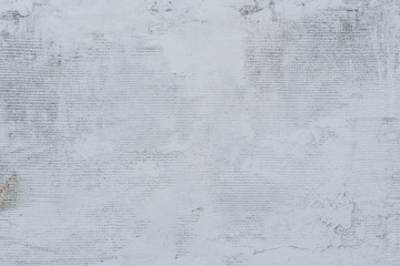 Texture of a concrete wall with cracks and scratches which can be used as a background
