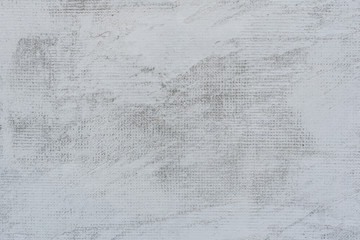 Naklejka premium Texture of a concrete wall with cracks and scratches which can be used as a background