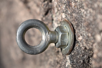 detail of steel bolt anchor eye in rock