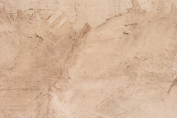 Texture of a concrete wall with cracks and scratches which can be used as a background