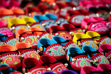 Colorful handmade kids sandals on street market in Thailand