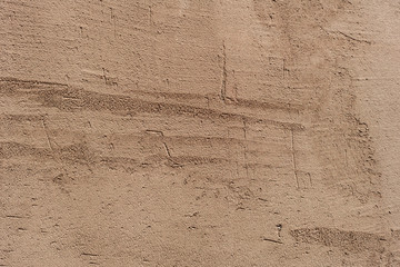 Texture of a concrete wall with cracks and scratches which can be used as a background