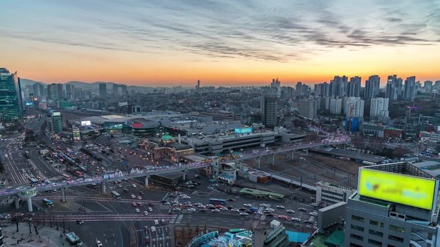 car traffic in front of the seoul station at dusk in seoul,Korea