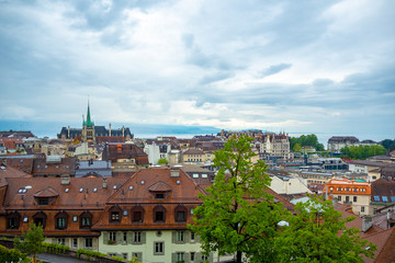 Obraz premium Beautiful panorama view of Lausanne city with cloudy sky for background with copy space, Switzerland