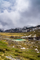 Fototapeta premium Montenegro, Azure blue clear waters of mountain lake valovito jezero in durmitor national park highlands nature landscape seen from sedlo pass route near zabljak