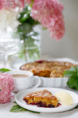 Blackcurrant and almond cake with vanilla ice cream