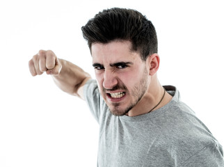 Human expressions and emotions. Young attractive aggressive man with an angry face