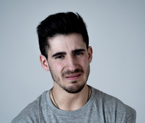 Obraz premium Human expressions and emotions. Portrait of young attractive sad and depressed man