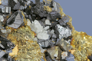Crystals of pyrite on galena on a  blue background