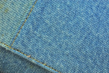 stitching on blue jeans background or texture