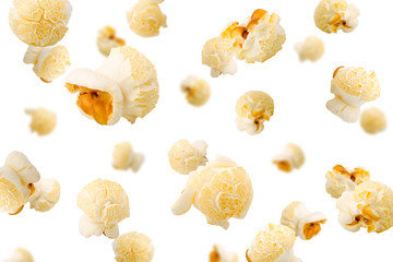 Falling popcorn, isolated on white background, selective focus