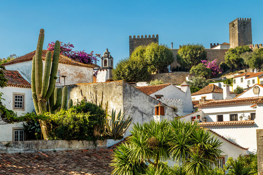 View of Obidos, Portugal. A small town surrounded by medieval castle walls. Popular touristic destination near Lisbon.