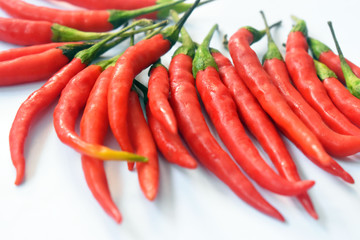 close up fresh red chilies, spicy isolated white background