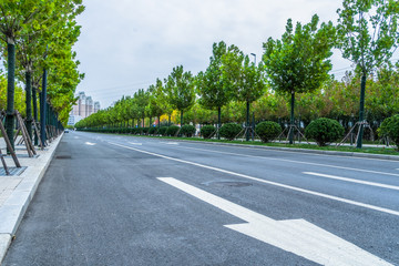 Fototapeta na wymiar city road through modern buildings in tianjin