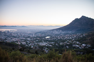 Fototapeta na wymiar Sunrise On Lion's Head and Signal Hill Looking over Cape Town City In The Early Morning in South Africa