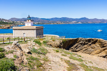 Fototapeta na wymiar Aranella lighthouse in the bay of Port of La Selva