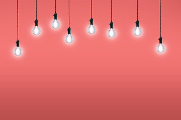 Idea and leadership concept bulbs on the Living Coral color background