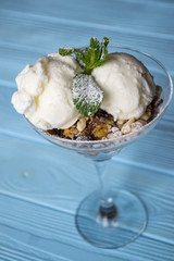 Ice cream on a blue wooden table.