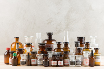 Retro pharmacy - vintage pharmacy bottles on wooden board