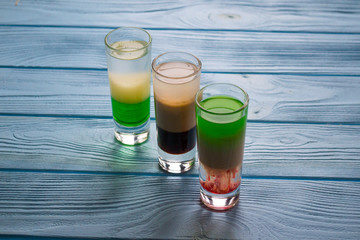 The alcohol shots on a table.