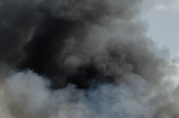 Fototapeta na wymiar Black smoke fire clouds background