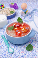 Oatmeal for baby feeding with plum jam