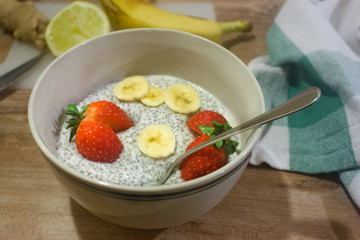 Chia seed  pudding with strawberrry and banan slices. Quinoa porridge. Vegetarian food.