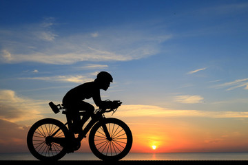 Silhouette  Cycling  on blurry sunrise  sky   background.