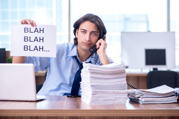 Young employee unhappy with excessive work 