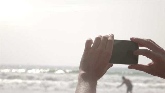 Man taking picture by mobile phone in slow motion 250fps