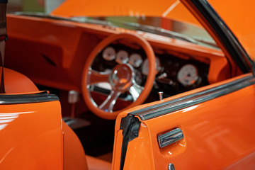 Close Up Of Matching Interior Of Orange Classic Vintage Car - Powered by Adobe