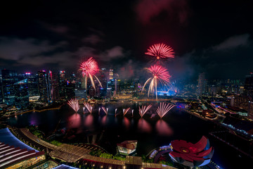 Aerial view of Singapore national day fireworks celebration at Marina Bay cityscape