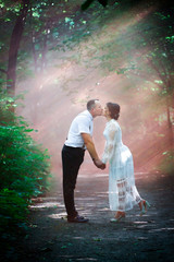 couple kissing in pink fog