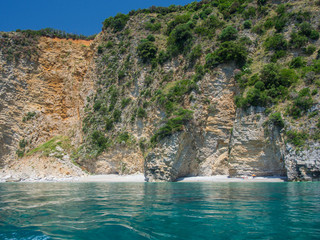 Obraz premium Rocky shores and blue Adriatic sea near the town of Budva, Montenegro
