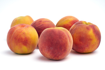 Fototapeta na wymiar Several peaches isolated on white background.