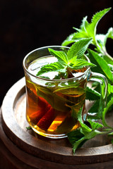 Close-up cup of mint tea with herbs