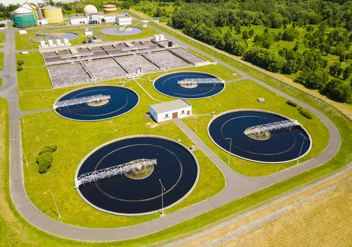 Aerial View Of Sewage Treatment Plant. Industrial Water Treatment For Big City From Drone View. Waste Water Management.