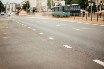 urban car asphalted road in defocus, street without people, transport in the city