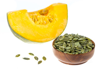 Raw green Pumpkin seeds isolated on white background