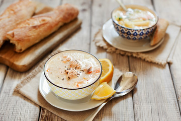 Finnish fish Soup with salmon, cream and potatoes in a bowl traditional soup in Nordic countries