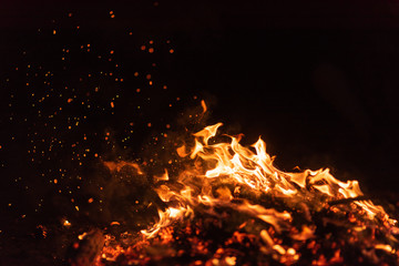 fire flames with sparks on black background