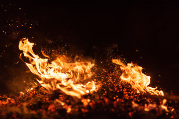 fire flames with sparks on black background