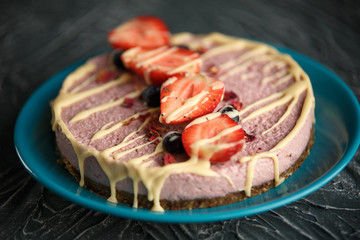 Raw healthy vegan cheesecake, homemade with cashew, mint and strawberries