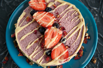 Raw healthy vegan cheesecake, homemade with cashew, mint and strawberries