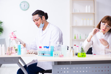 Two chemists working in the lab