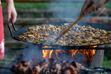 cooking meat at bbq fire