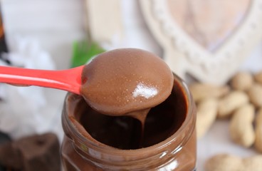 Peanut butter on a red spoon