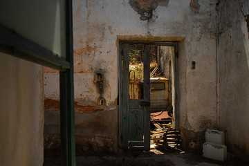 Fototapeta na wymiar Insight into a deserted, rundown house in Rhodes, Greece